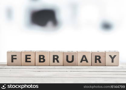 February sign on wooden blocks on a table