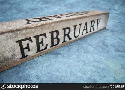 February text on grunge wooden block, calendar concept