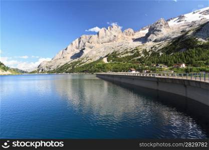 Fedaia lake beneath Marmolada glacier, Trentino, Italy