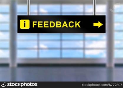 feedback word on airport sign board with blurred background