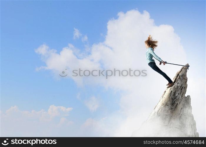 Feeling of freedom. Young girl with ropes on hands trying to fly