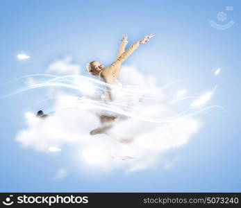 Feeling of lightness. Young pretty ballerina girl making jump in dance