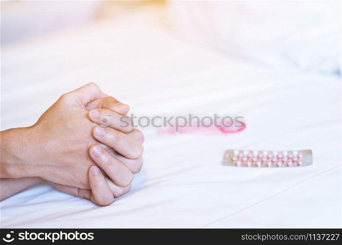 Feeling on hands of passion couple having sex. two Lovers couple Holding hands under blanket white sheets on the bed with lust and making love. concept having sexual romantic moments.