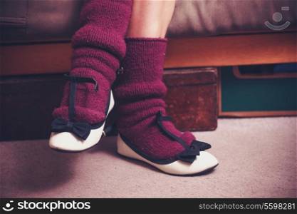 feet of a woman wearing purple socks