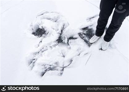 feet of girl rolling on ice skates on frozen lake.. feet of girl rolling on ice skates on frozen lake