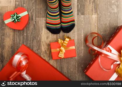 Feet of little children on wood floor. Christmas holidays concept