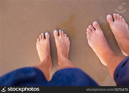 Feet of two lovers on sand-summer, sun, sea, beach. Feet of two lovers on sand-summer, sun, sea, beach.