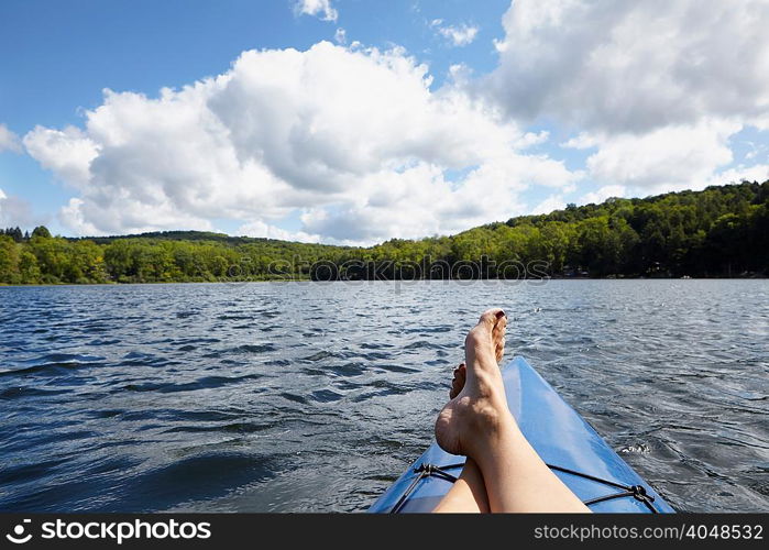 Feet up on canoe, New Milford, Pennsylvania, US