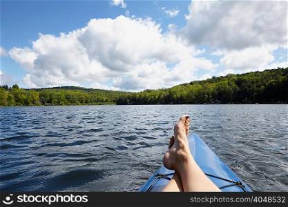 Feet up on canoe, New Milford, Pennsylvania, US