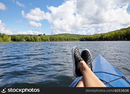 Feet up on canoe, New Milford, Pennsylvania, US