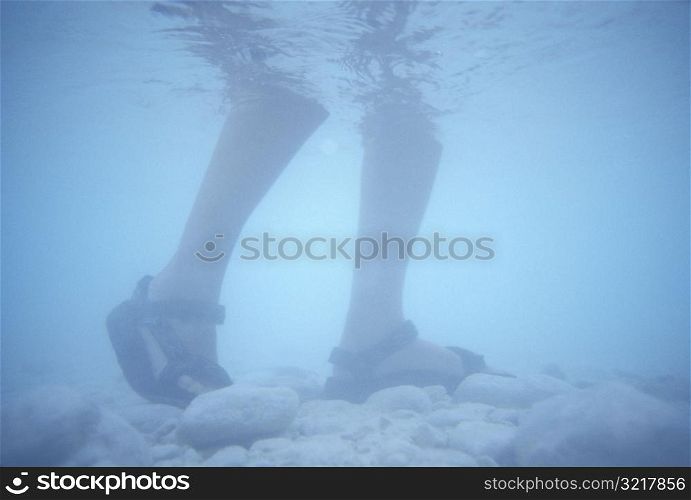 Feet Walking Underwater