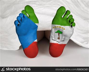 Feet with flag, sleeping or death concept, flag of Equatorial Guinea