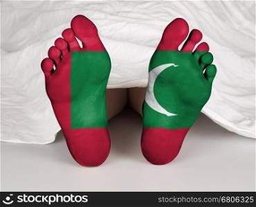 Feet with flag, sleeping or death concept, flag of Maldives