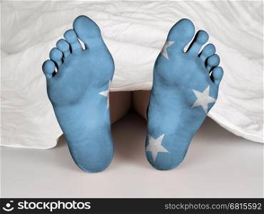 Feet with flag, sleeping or death concept, flag of Micronesia