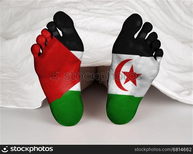 Feet with flag, sleeping or death concept, flag of Western Sahara