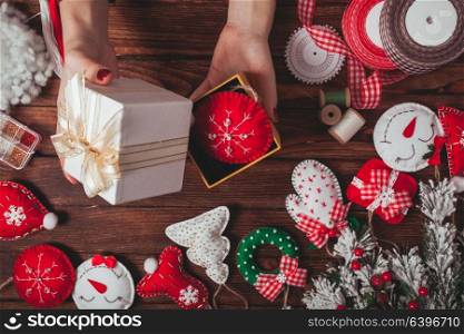 Felt Christmas decorations in a present box. Felt Christmas decorations