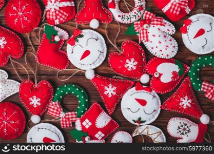 felt Christmas decorations on the wooden table as a background. felt Christmas decorations