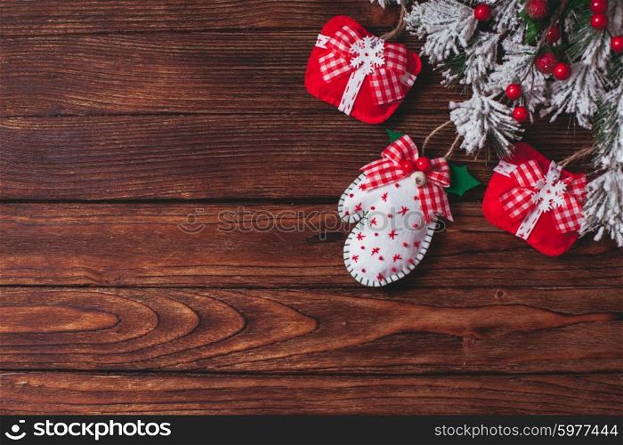 felt Christmas decorations on the wooden table with copy space. felt Christmas decorations