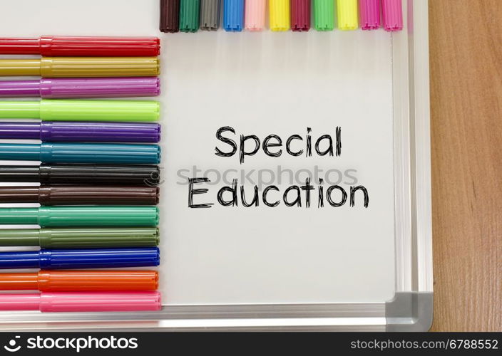 Felt-tip pen and whiteboard on a wooden background and special education text concept