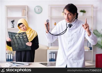 Female arab patient visiting male doctor. Female arab patient visiting male doctor 