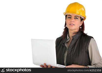 Female architect holding laptop computer