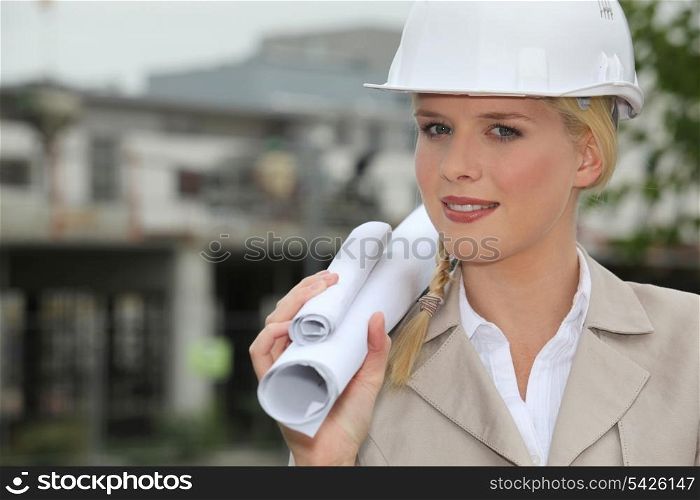 Female architect holding plans