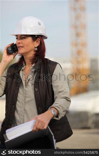 Female architect with radio