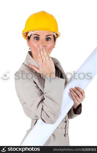 Female architect with shocked expression on face