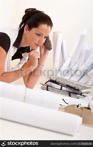 Female architect with telephone at the office