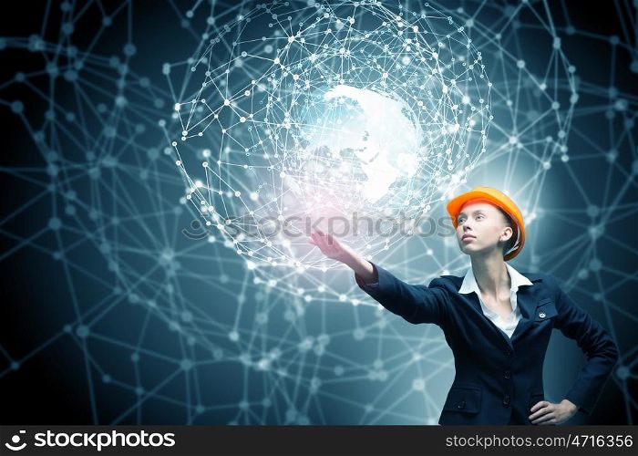 Female architect woman. Engineer woman in helmet and global connection concept