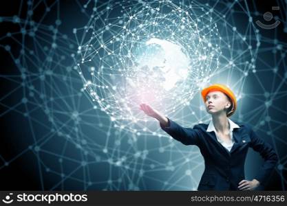 Female architect woman. Engineer woman in helmet and global connection concept