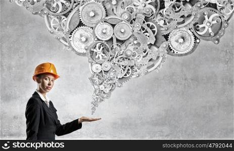 Female architect woman. Young engineer woman reaching hand with gears flying out