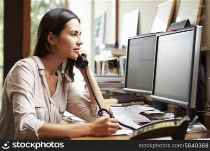 Female Architect Working At Desk On Computer