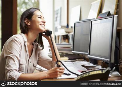 Female Architect Working At Desk On Computer