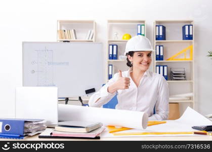 Female architect working in the office 