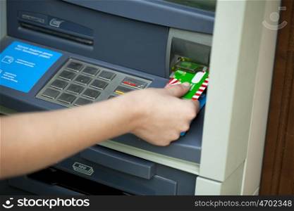 Female arms Take cash from the ATM, close up