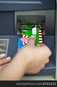 Female arms Take cash from the ATM, close up