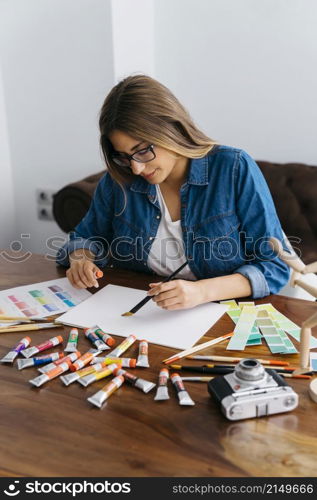 female artist painting desk