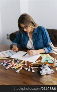 female artist painting desk