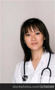 Female Asian doctor with lab coat and stethoscope