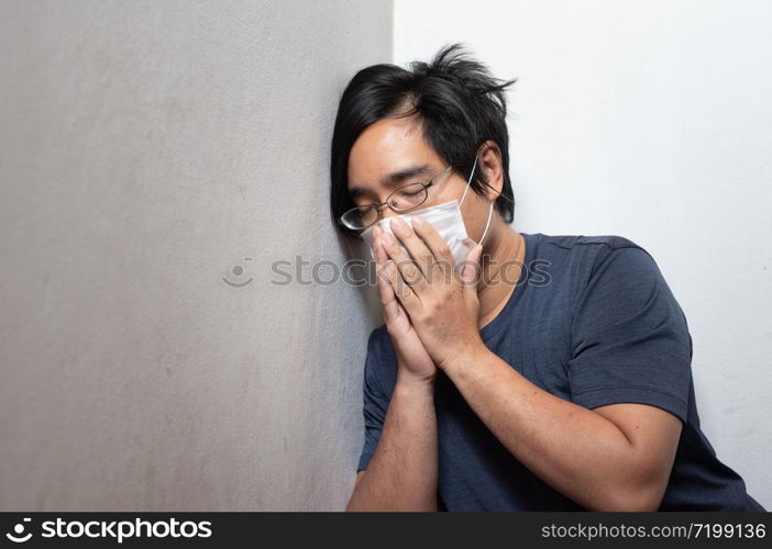 Female Asian young woman wearing surgical mask feeling sick headache and coughing leaning on wall isolated on white background.Wuhan coronavirus (COVID-19) outbreak prevention. Health care concept