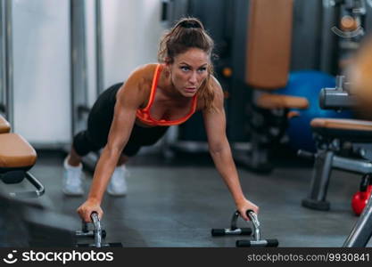 Female Athlete Doing Push-Ups in The Gym