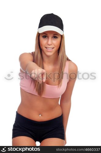 Female athlete ready for sports pointing at camera with the finger isolated on a white background