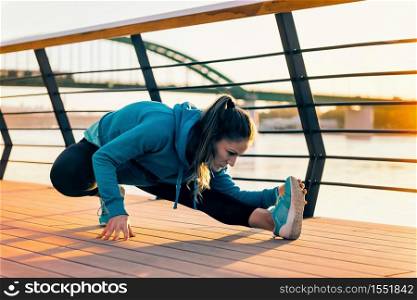 Female athlete streching outdoors