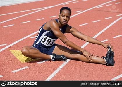 Female athlete stretching
