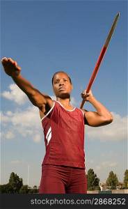 Female athlete throwing javelin