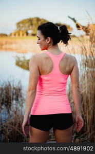 Female athlete with sportswear in nature to train