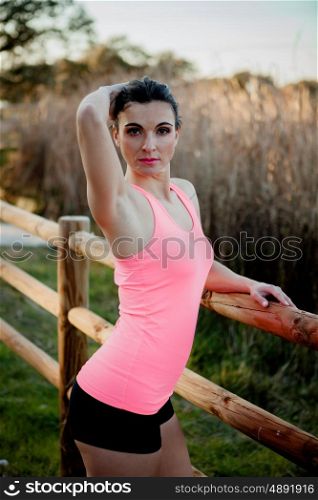 Female athlete with sportswear in nature to train