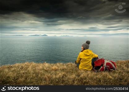 Female backpacker tourist in Icleand resting after a long day of adventures