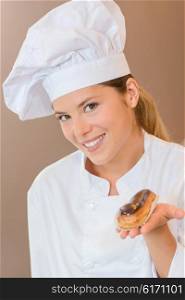 Female baker presenting you with an eclair